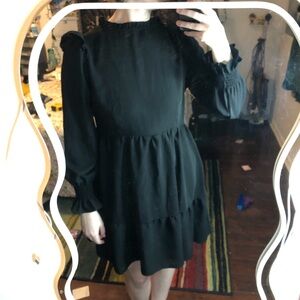 4/$25 Elegant black dress with long bishop sleeves and a ruffle skirt